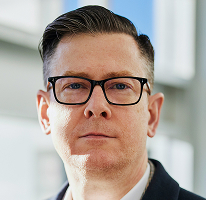Foto di Alexander Hughes executive e CEO di un'azienda di trading di criptovalute